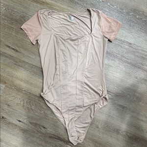Beige Short Sleeve Bodysuit with mesh sleeves. Medium avidlove
